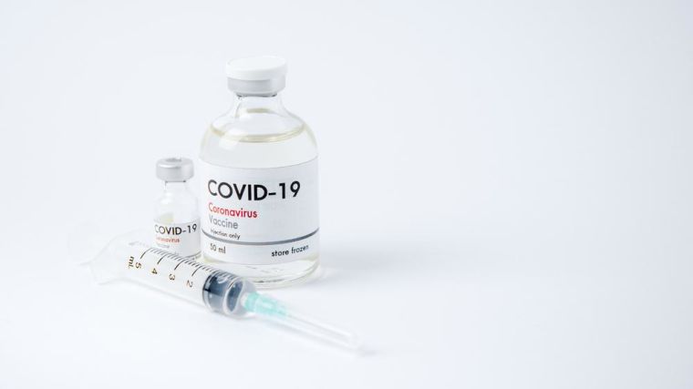 Close-up of COVI-19 vaccine and injectables