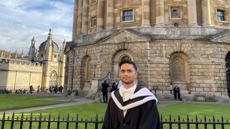 Ali Anis graduation outside Radcliffe Camera